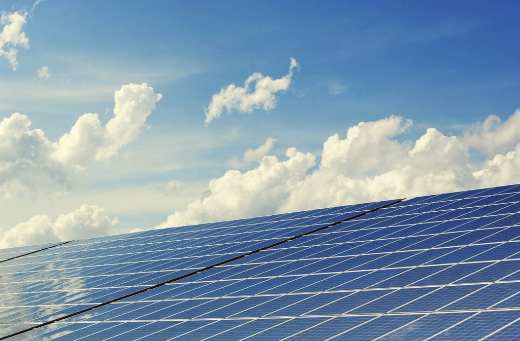 Row of solar cells and a blue sky