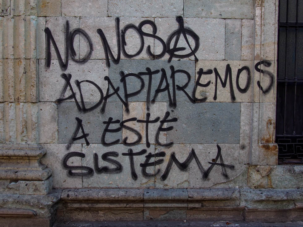 "No nos adaptaremos a este sistema" (we will not adapt to this system) - anarchist graffiti in Oaxaca, Mexico