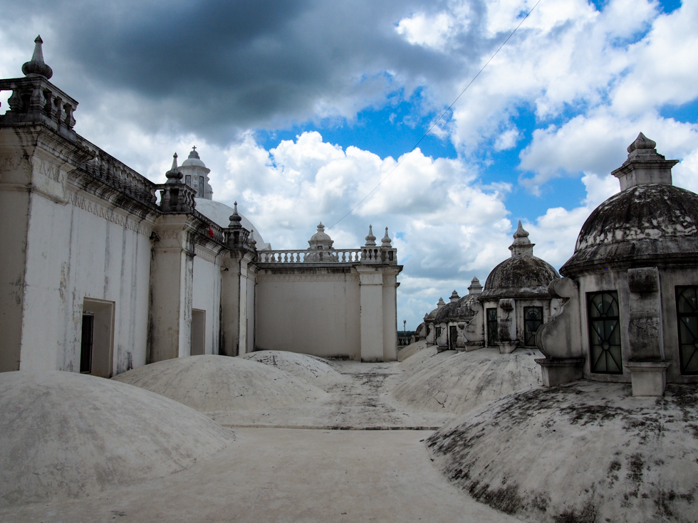 A row of domes on the rooftop of the  cathedral in Leon, Nicaragua, on as the clouds roll in overhead