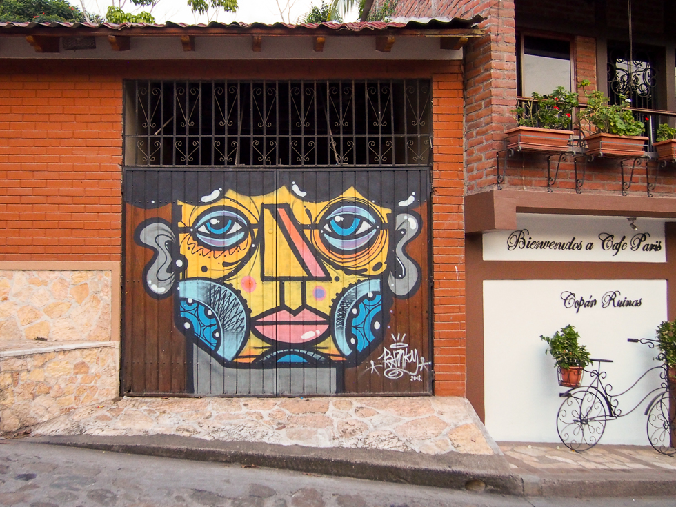 Some street art of a face on a garage door in the town of Copan Ruinas, Honduras